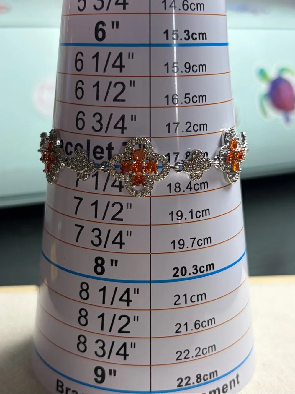 Silver Floral Bracelet with Orange Crystal Accents